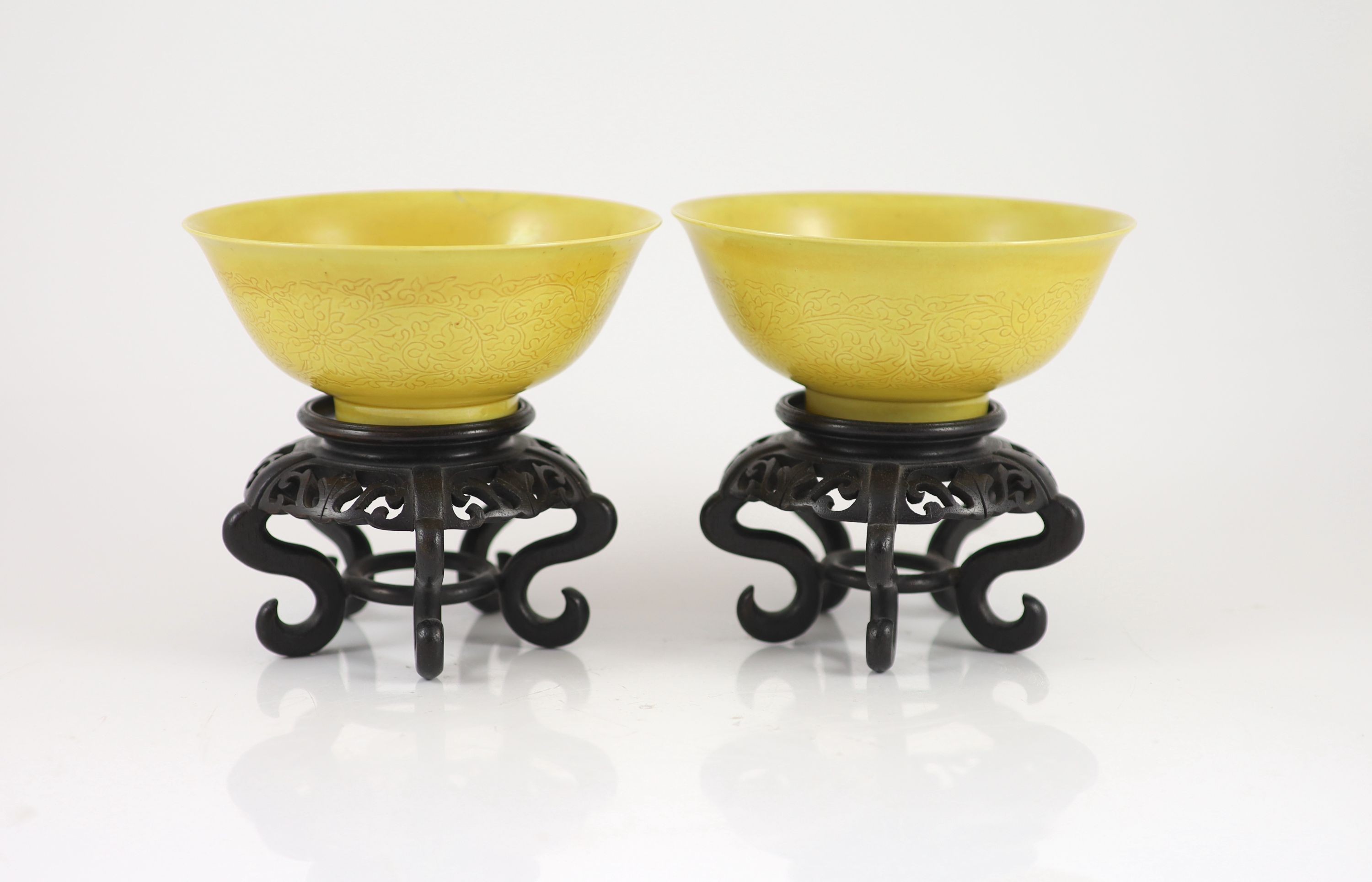 A pair of Chinese yellow ground sgraffito bowls, Kangxi mark but mid 20th century,